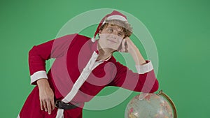 Adult Man Santa Claus Posing On A Globe