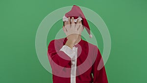 Adult man santa claus slapping his forehead