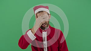 Adult man santa claus slapping his forehead