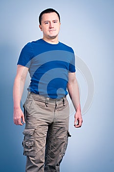 Adult man standing with a smirk face photo