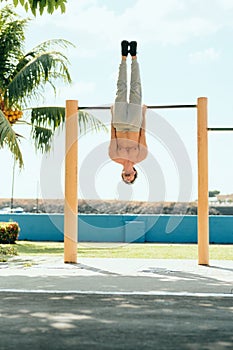 Adult Man Training ABS Abdominals Muscles Doing Calisthenics Outdoors