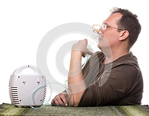 Adult man using inhalter