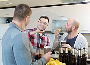 Adult men relaxing with beer