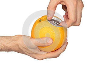 Adult opening an orange soft drink in a orange `package`, isolated