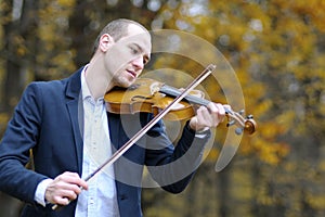 Adult playing at violin photo
