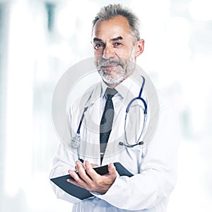 Adult qualified physician diagnostician, with a stethoscope