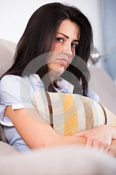Adult sad female melancholy with pillow