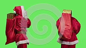 Adult saint nick carry red sack