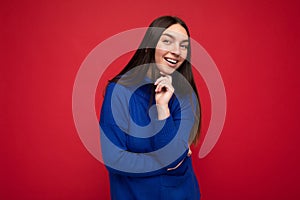 Adult smiling happy beautiful brunette woman with sincere emotions isolated on background wall with copy space wearing