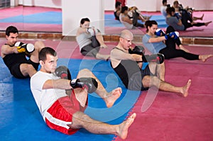 Adult sportsmen practicing boxing punches