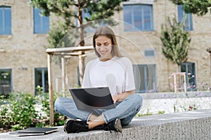 Adult student girl using modern laptop computer
