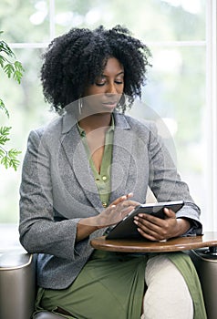 Adult Student Taking an Online Course with a Tablet