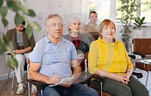 Adult students listening in classroom university