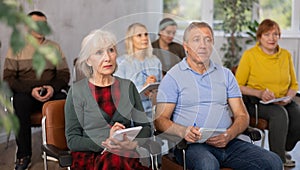 Adult students listening in classroom university