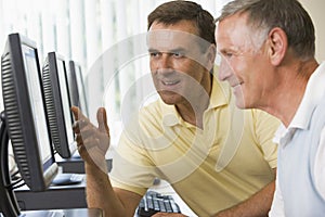 Adult students working on computers