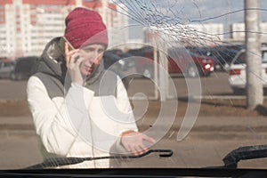 Upset young woman after a car accident calling on the phone