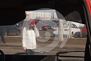 Upset young woman after a car accident