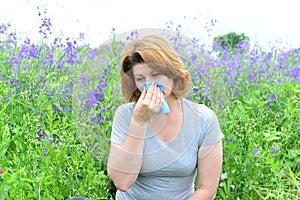 Adult woman with allergies on the Meadow