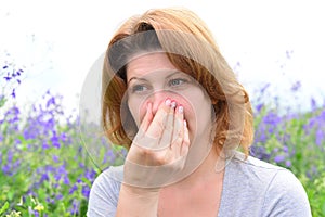 Adult woman with allergies on the Meadow