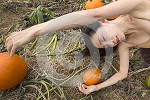 Adult woman dancing in a Connecticut pumpkin patch in autumn