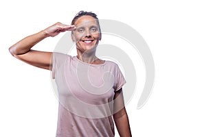 adult woman giving a military salute on a white background