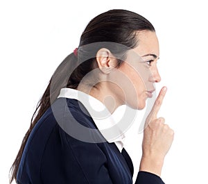 Adult woman giving the shhh. Be quit sign.