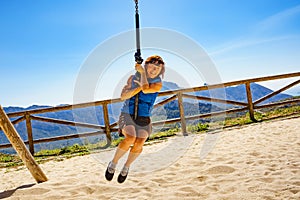 Adult woman having fun on zipline