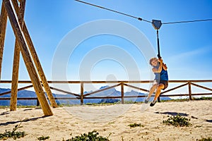 Adult woman having fun on zipline