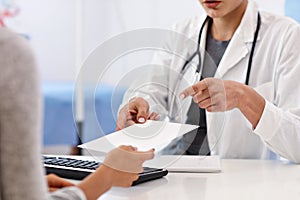 Adult woman having a visit at female doctor`s office