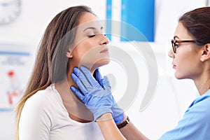 Adult woman having a visit at female doctor`s office