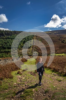 Adult woman hiking in Wicklow Mountains, Ireland