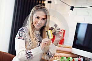 Adult woman at home wrapping Christmas presents