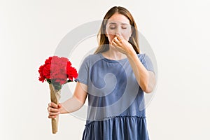 Adult woman with an itchy nose and sneezing