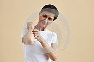Adult woman looking at skin irritation spot
