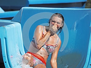 Adult woman playing in a water park