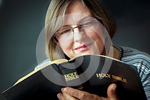 Adult Woman Reading a Bible