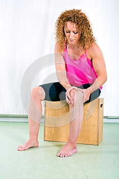 Adult woman rehabilitating injured leg