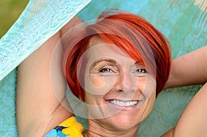 Adult Woman Relaxing on Hammock at the Garden