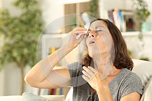 Adult woman sweating suffering heat stroke at home