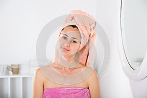 Adult woman with a towel on her head