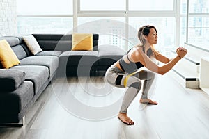 Adult Woman Training Legs Doing Side Squat at Home