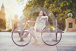 Adult woman with vintage bike