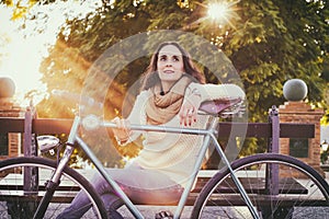 Adult woman with vintage bike