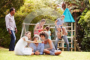 Adults and kids having fun in a garden