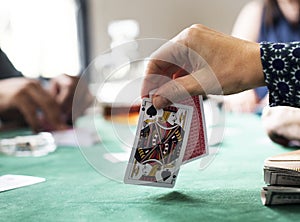 Adults socialising and playing cards