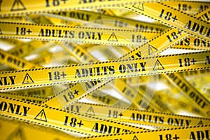 Adults only, yellow warning tapes with inscription