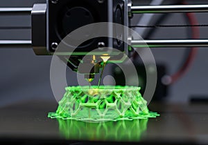 Advanced 3d printer creating complex green structure
