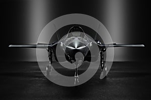 Advanced F35 secret jet in an undisclosed location with silhouette lighting. photo