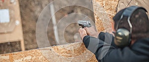 Advanced outdoor tactical shooting on target around barrier and wall