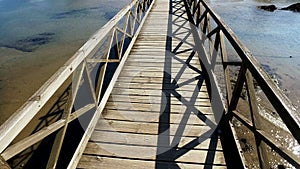 Advancing by footbridge from castle to Santa Cruz beach 11